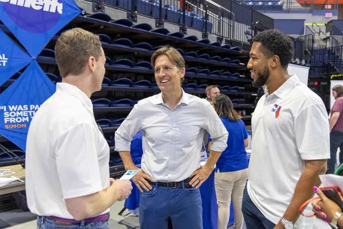 UF president Ben Sasse speaks with P&G recruiters during the first day of Career Showcase.