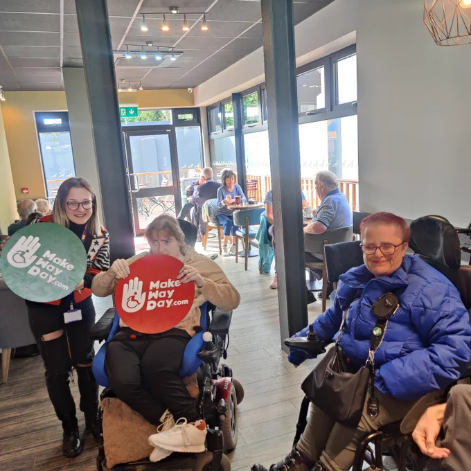 2 powerchair users and their PA 