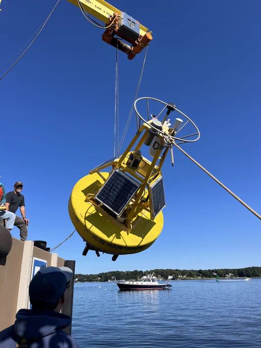 Researchers deploy an ocean observing buoy in New Hampshire at the UNH research pier. 
Credit: NOAA OAP