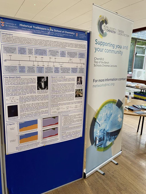 A poster containing a timeline of diversity in the St Andrews chemistry department alongside a RSC local section poster board
