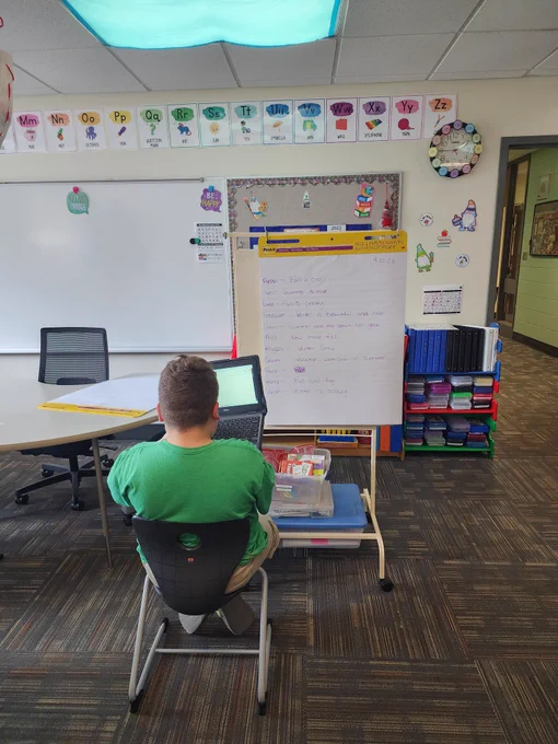 Student using co-writer on chromebook to copy his sentence from a model