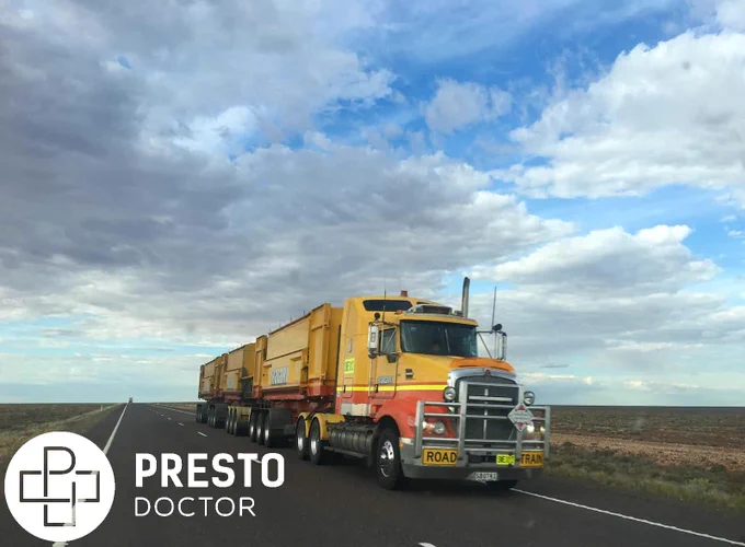 Semi truck driving down open road