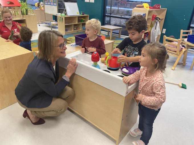 Commissioner Kershaw talking with three kids at the Cape Cod YMCA