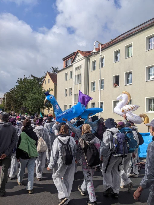 Activists on route, carrying inflatable Pegasus and other fantasy animals