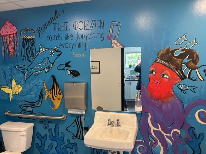 A mural in the restroom at 826MSP showing fanciful undersea creatures.