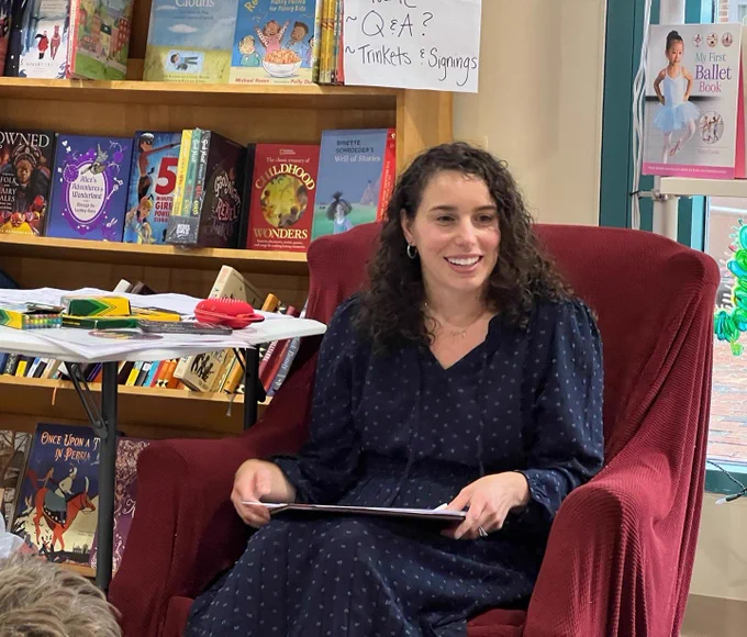 Me sitting in an armchair for the Q&A portion of the presentation.