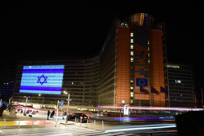 The façade of the European Commission’s headquarter in Brussels illuminated at night with the flag of Israel. 