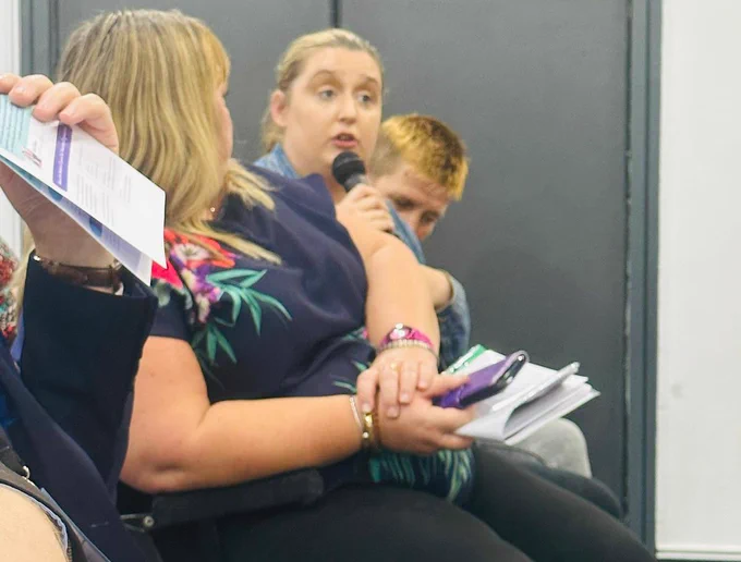 Audience member asks question