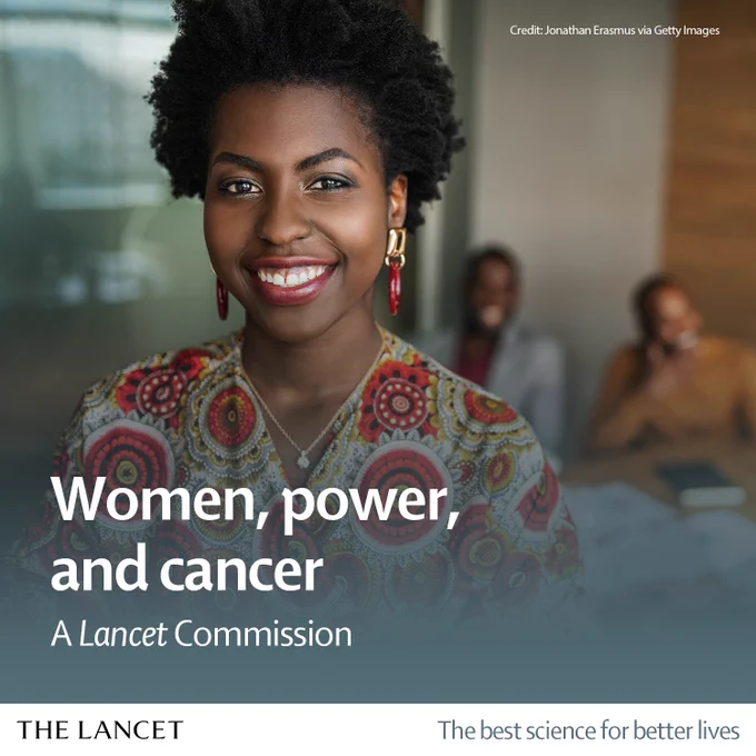 Image of a woman smiling into the camera during a boardroom meeting. Credit: Jonathan Erasmus via Getty Images.