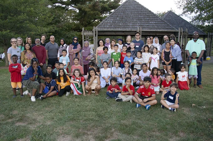 ESOL students, teachers and families of Ballwin, Westridge and Woerther elementary schools gathered for a group photo at Vlasis Park in Ballwin.