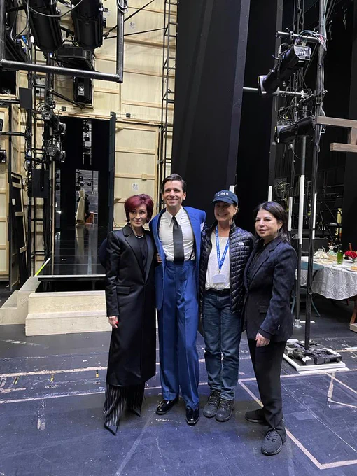 Sharon Osborne, Matt Doyle, Tina Sinatra and Michelle Anthony posing for a photo on The Rep stage. They are all smiling.