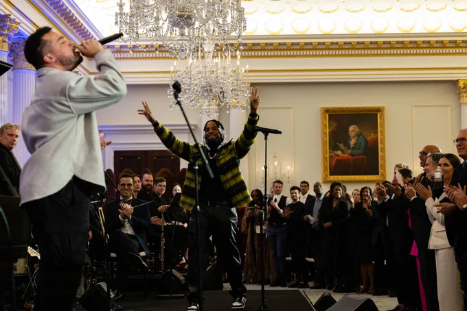 Armani White and musicians perform at a launch event for the Global Music Diplomacy Initiative in the ornate Benjamin Franklin Reception Room at the Department of State.
