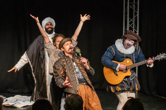 The cast of The Real William Shakespeare... As Told By Christopher Marlowe singing and dancing.