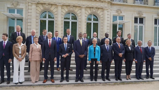 Secretary Granholm and members of the Nuclear Energy Agency (NEA) stand together at the Roadmaps to New Nuclear forum in Paris, France, on September 28, 2023.