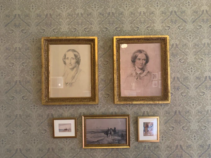 Framed pictures of Elizabeth Gaskell and Charlotte Brontë