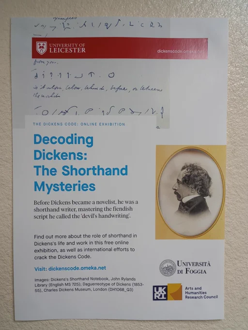 Photo of info poster with side portrait of Charles Dickens with Visit: dickenscode.omeka.net