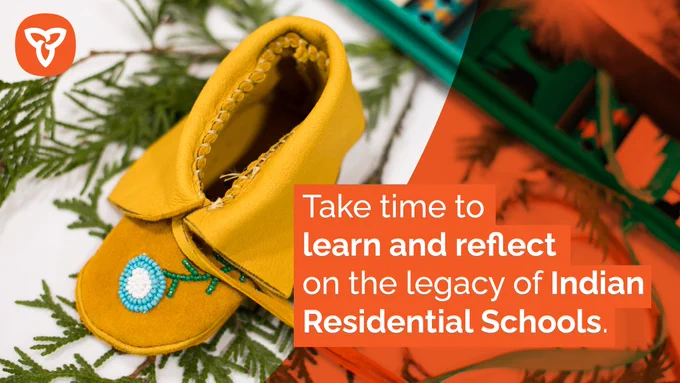 Background image is a child’s moccasin laying on top of spruce needles. Text on image reads “Take time to learn and reflect on the legacy of Indian Residential Schools”