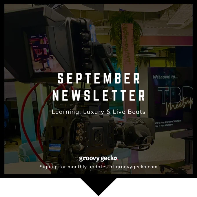 September Newsletter words overlayed on a background image of a camera in a studio