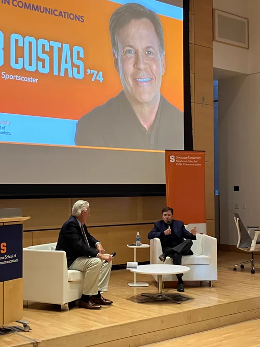 Bob Costas speaks with John Nicholson on stage