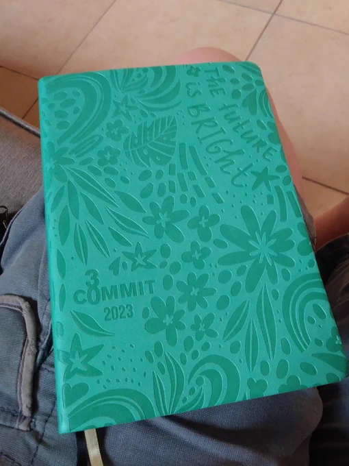 Cover of planner, which is mint green and says "The future is bright" and "Commit30 2023"