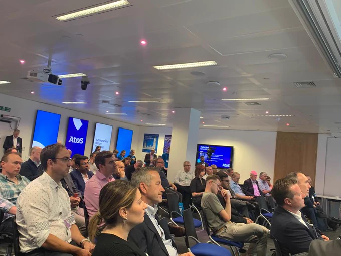 A group of audience listening to the event sessions