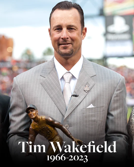 In memoriam, Tim Wakefield (1966-2023)
Pictured: Wakefield smiles with the Roberto Clemente Award trophy in a gray suit.