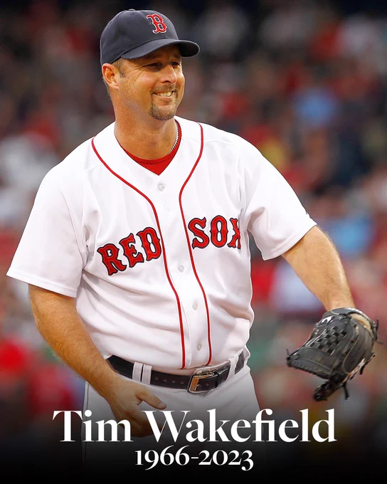 In memoriam, Tim Wakefield (1966-2023)
Pictured: Wakefield smiles after he delivers a pitch. He wears a home white Red Sox uniform with red lettering.