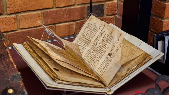Medieval manuscript fanned to show different folios [LPL, Arches Ff 291] 
