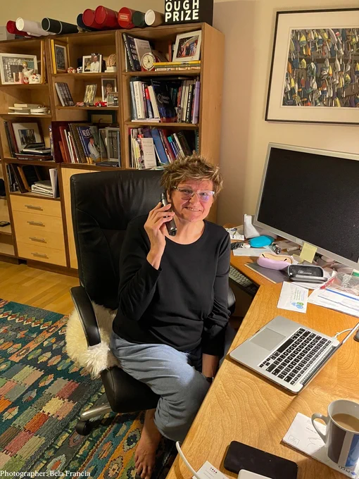 Katalin Karikó on the phone with her sister. She is smiling. 