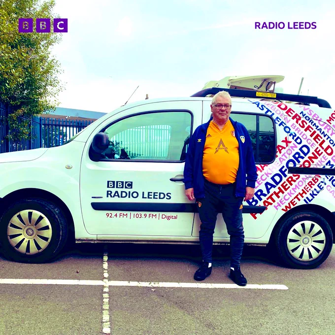 Alan Stubbs, driving instructor, standing in front of the BBC Leeds radio van