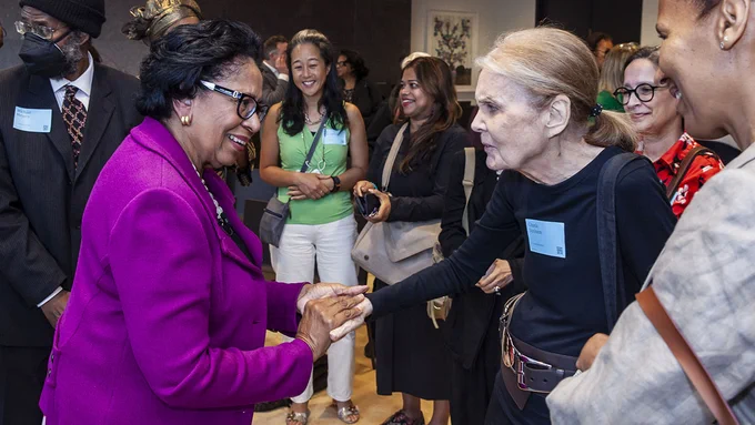 Ruth J. Simmons shakes hands with Gloria Steinem