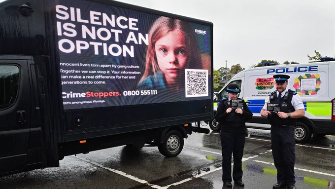 Officers with an ad van