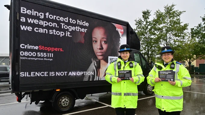 Officers with an ad van