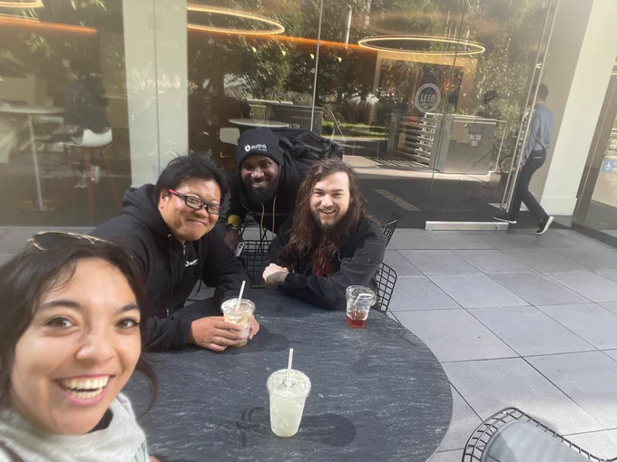 Lizzie, Daizen, Corey, and Sam cheesing it with andytown coffee at salesforce park 