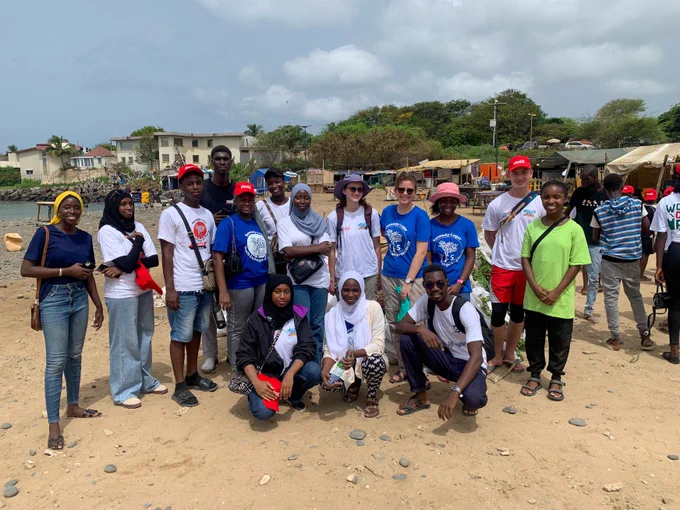 Group of YES alumni from Senegal pose on beach