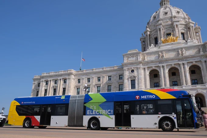 A Metro Transit electric bus in front of the Minnesota State Capitol Building in Saint Paul.