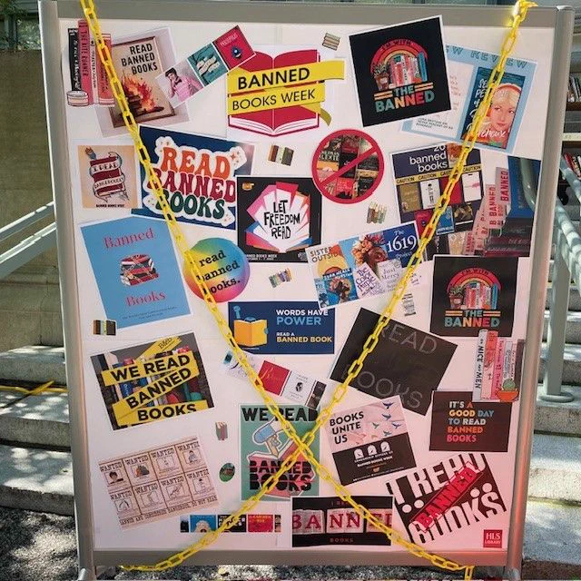 A close-up view of a colorful sign advertising Banned Books Week. 