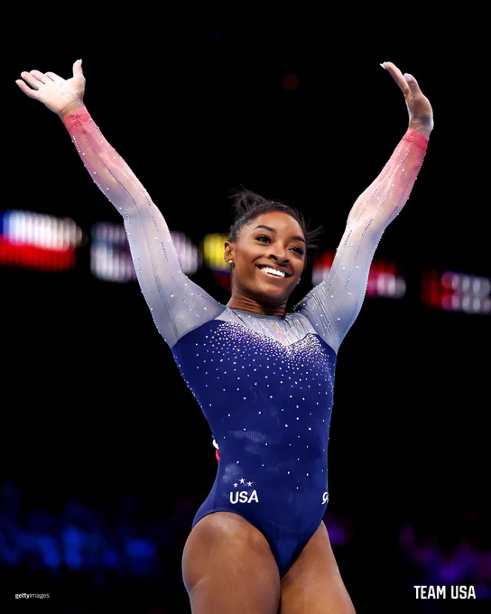 Simone Biles smiles after winning her 20th World Championship gold medal