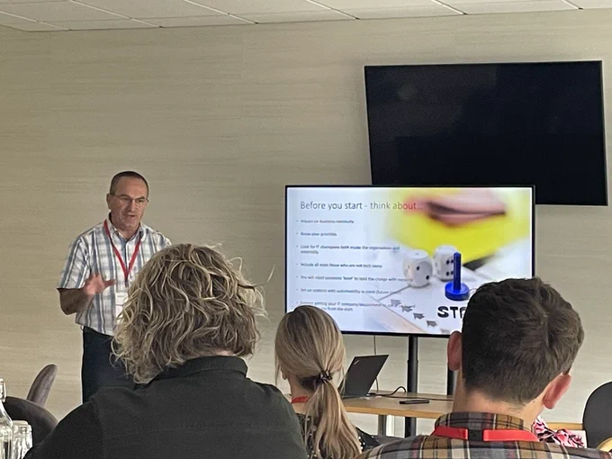 Marc Davies delivering PowerPoint presentation in front of audience