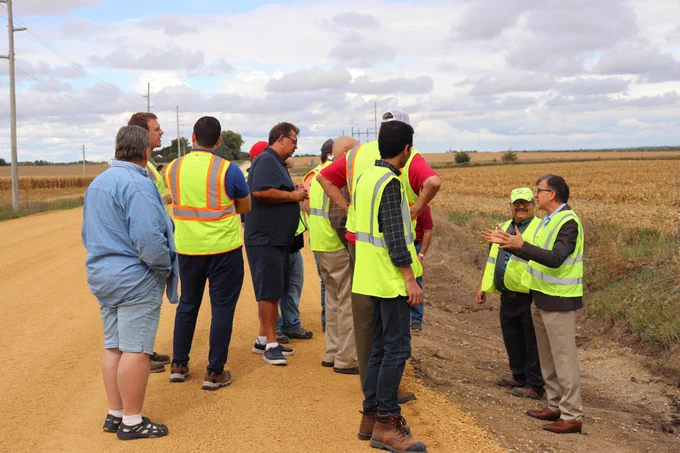 PROSPER Director Halil Ceylan, right, discusses base stabilization project at test site near Independence, Iowa