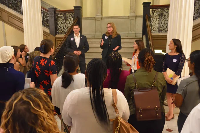 Social workers listen to Rep.Kushmerek and Rep.Barber before they go off and lobby their legislators.
