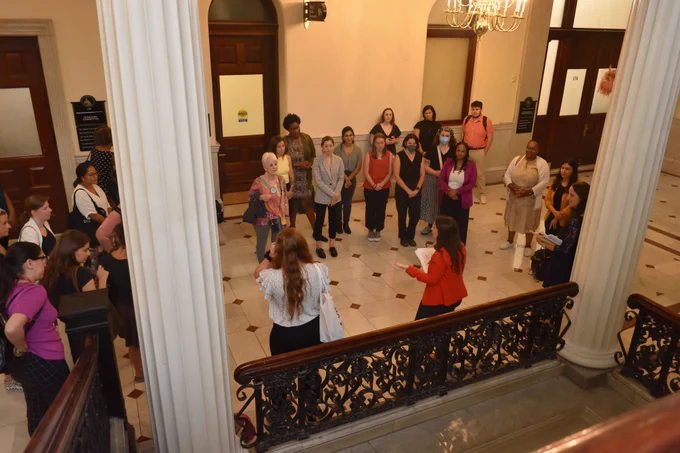 Social workers listen to instructions before they go off and lobby their legislators.