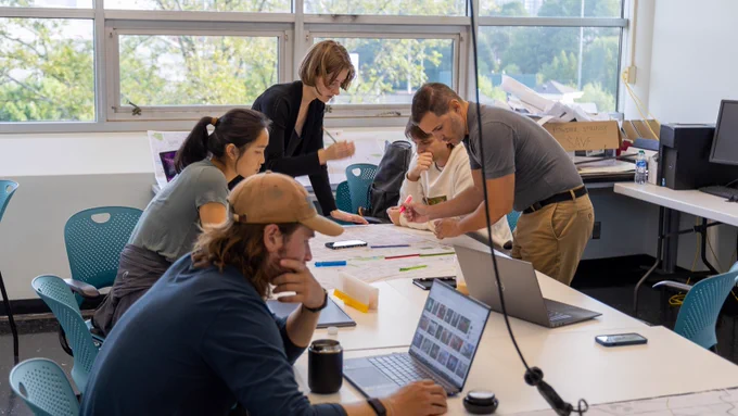 Planning students lay out transportation plans on a map of Midtown Atlanta.