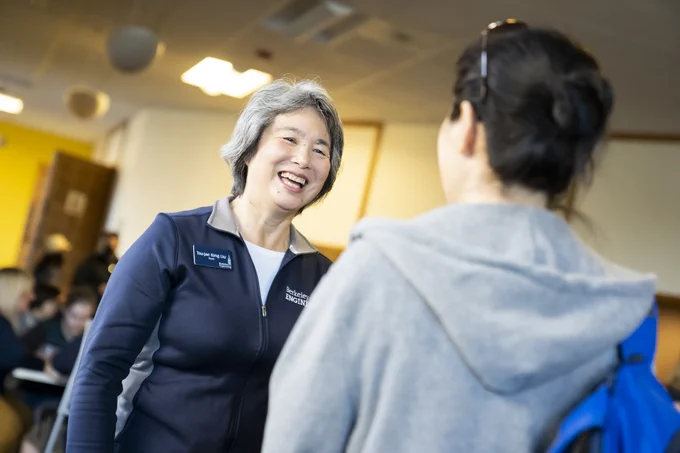 Dean Tsu-Jae Liu speaks with an attendee. (Photo by Adam Lau / Berkeley Engineering)