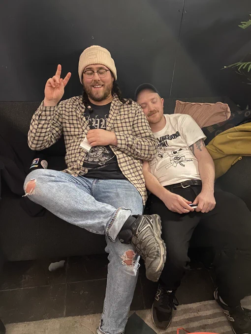 Dan and Nathy sitting on a couch.