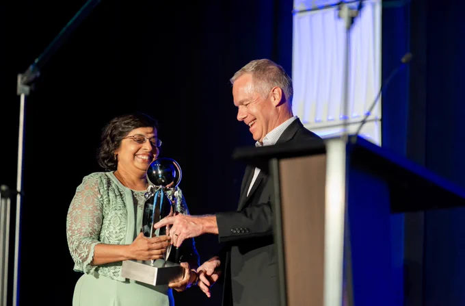 The associate dean accepting the award on behalf of the college.