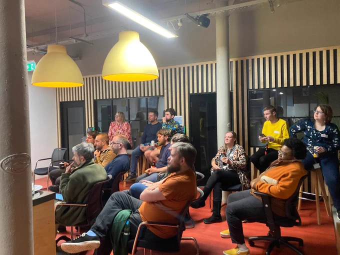 Side view of audience watching a presentation