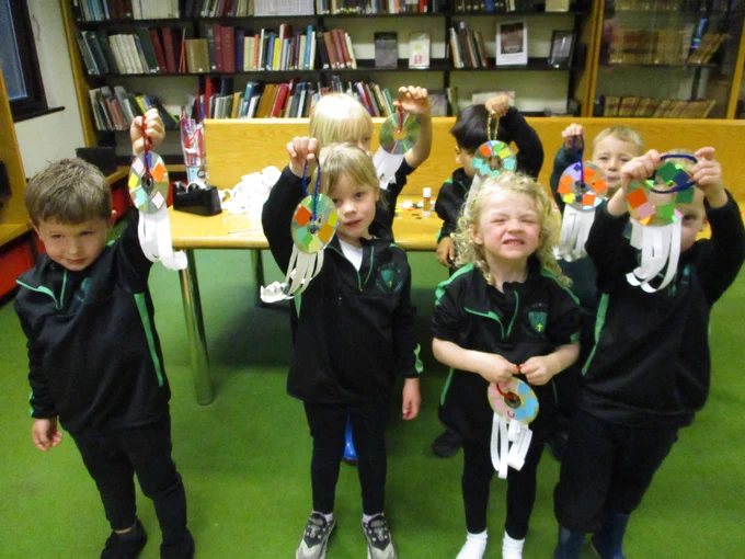 children with octopi made from recycled materials