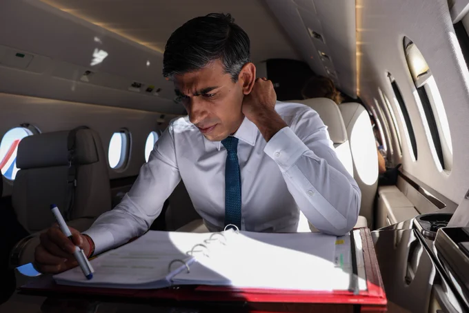 Prime Minister Rishi Sunak works as he travels to attend the European Political Community Summit (EPC).