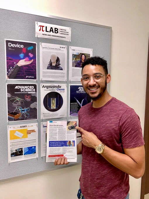 Marquise Bell with C&EN magazine showing story on self-decontaminating wearables he developed